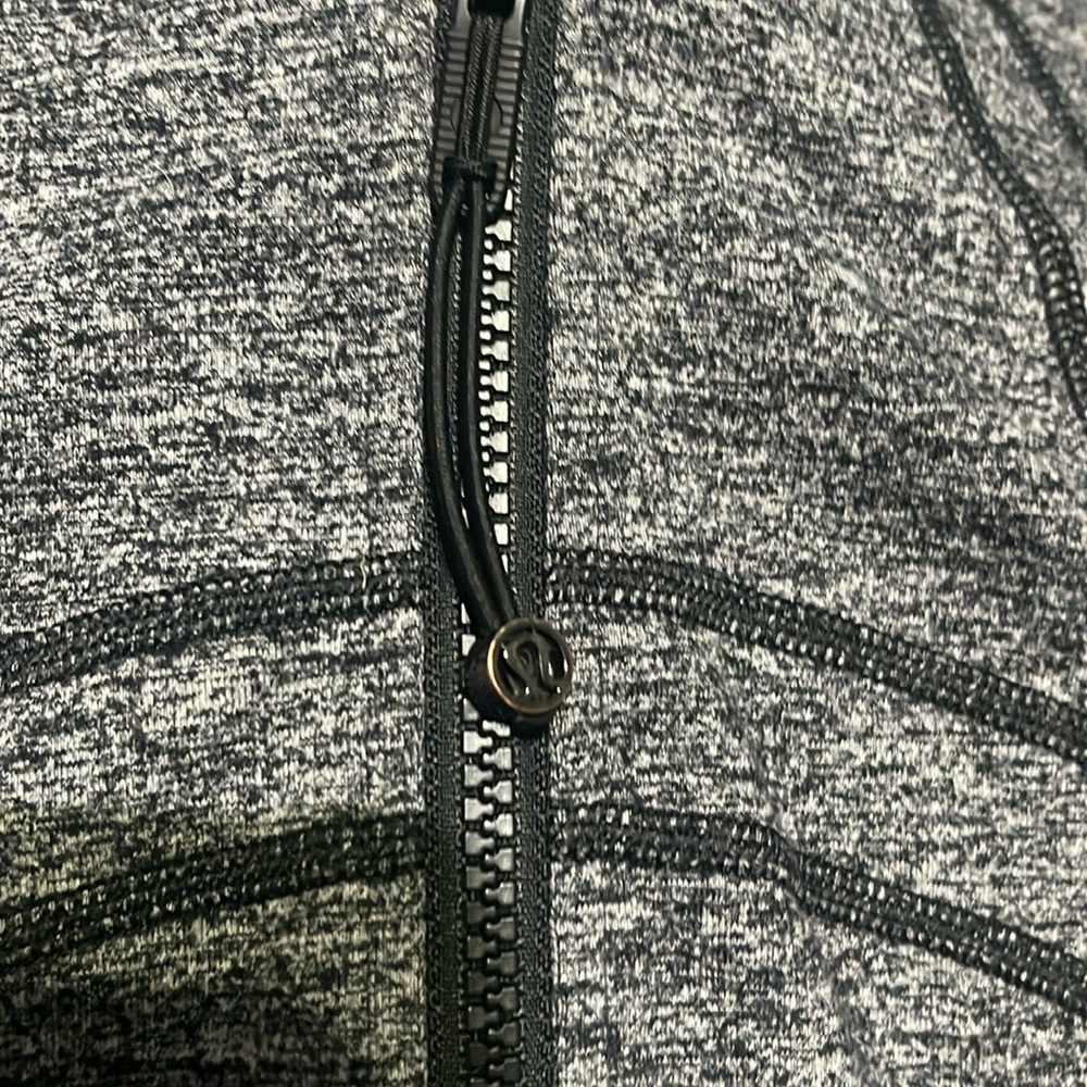Lululemon zip up with cuffed sleeves. Great condition.